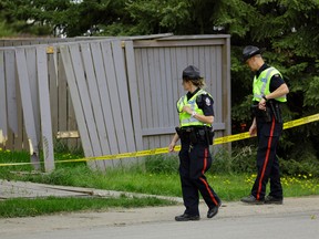 Police are investigating a hit and run near 190 Street and 85 Avenue in west Edmonton on Monday May 22, 2017. A vehicle crashed into a fence in a residential neighborhood injuring a man who was taken to hospital in critical condition. (PHOTO BY LARRY WONG/POSTMEDIA)