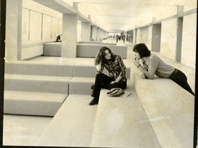 Two students sit in the "education marketplace" on level six of the University of Lethbridge during its early years. |Contributed/University of Lethbridge Archives photo