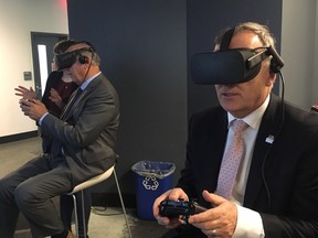 Submitted photo
Bay of Quinte MP Neil Ellis tries some cutting-edge technology following the announcement of a $500,000 investment in five local startups.