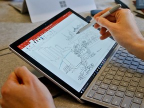 In this Tuesday, May 16, 2017, photo, Microsoft's new Surface Pro laptop-tablet hybrid is displayed, in New York. The Surface’s stylus will now mimic pencil shading when tilted, much like the Apple Pencil for iPad Pro tablets. Along with this, Microsoft plans upgrades to its popular Office software with new pencil-like features. (AP Photo/Bebeto Matthews)