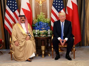 In this Sunday, May 21, 2017 file photo, U.S. President Donald Trump, right, meets with Bahrain's King Hamad bin Isa Al Khalifa in Riyadh, Saudi Arabia. Trump's administration had approved a multibillion-dollar sale of F-16 fighter jets to Bahrain without the human rights conditions imposed by the State Department under President Barack Obama. (AP Photo/Evan Vucci, File)