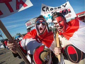 Andrew Moore, left, and Shawn Osman get pumped up in the Red Zone before Game 4.