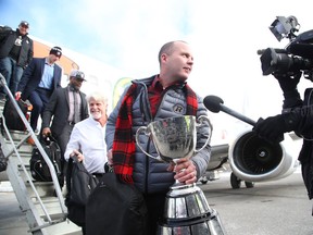 Rick Campbell, head coach of the Ottawa Redblacks, arrives in Ottawa after winning the Grey Cup on Nov. 28, 2016. (Jean Levac/Postmedia)