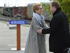 Ontario Premier Kathleen Wynne greets London city councillor Josh Morgan following an announcement about high speed rail at the Carling Heights Optimist Centre. (MORRIS LAMONT, The London Free Press)