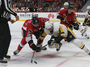 Senators Colin White takes a face-off against Matt Cullin of the Penguins during first period action Tuesday night. (Tony Caldwell/Ottawa Sun)