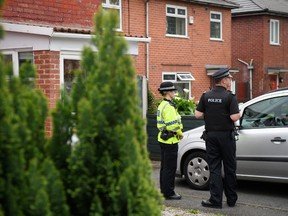 Police officers guard the location of a building where it is believed a number of arrests were made in connection with terrorist Salmon Abedi on May 24, 2017 in Manchester, England. (Photo by Leon Neal/Getty Images)