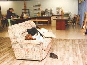 Kate Daprat, 16, local to Vulcan plays on her phone on the couch, while assistant youth coordinator for the youth centre Sandy Heldt irons in the back. They both enjoy the space as the centre’s flooring has been replaced and the walls have been painted.