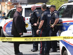 Greater Sudbury Police investigate an incident on the Lloyd Street hill that sent one male to hospital with critical injuries on Wednesday afternoon. (John Lappa/Sudbury Star)