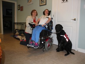 Bonnie and Kate Getty with Kate’s service dog, Kaizen at their home in London. Kaizen came home in September of last year and has changed Kate’s life for the better, making her more independent than ever. They will be participating in the Walk for Dog Guides in Port Stanley on Sunday. (Laura Broadley/Times-Journal)