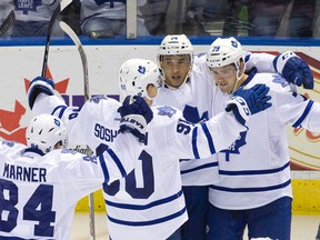 The Toronto Maple Leafs celebrate a goal by forward Michael Joly, second from right, during an NHL Rookie Tournament game against the Pittsburgh Penguins at Budweiser Gardens in London on Sept. 13, 2015. (Craig Glover/The London Free Press/Postmedia Network)