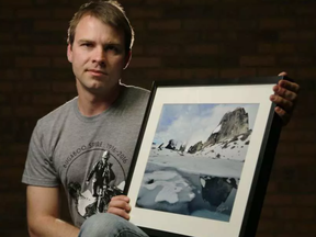 Ottawa photographer and alpinist Ivan Petrov with a photograph of Snowpatch Spire in Bugaboo Provincial Park, B.C. DARREN BROWN / POSTMEDIA