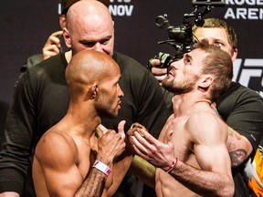 Demetrious Johnson, UFC flyweight champion, left, and contender Ali Bagautinov square off during UFC 174 official weigh-ins at Rogers Arena in Vancouver on June 13, 2014. (Carmine Marinelli/Postmedia)