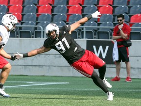 Defensive end Greg Townsend Jr. (right) battles with Lene Maiava during the Ottawa Redblacks rookie camp yesterday at TD Place. (JEAN LEVAC/Postmedia Network)