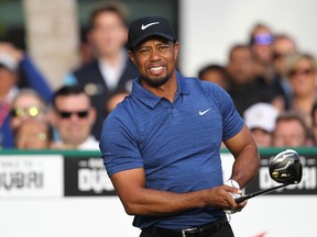 This file photo taken on February 1, 2017 shows Tiger Woods of the United States playing a shot during the Dubai Desert Classic golf tournament at the Emirates Golf Club in Dubai. (AFP PHOTO/NEZAR BALOUT)