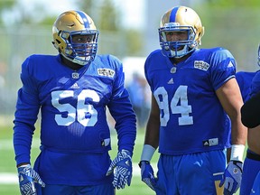 Faith Ekakitie, left, and Jackson Jeffcoat are seen during Winnipeg Blue Bombers rookie camp on the University of Manitoba campus in Winnipeg on May 24, 2017. (Kevin King/Winnipeg Sun/Postmedia Network)