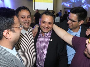 Calgary PC candidate Prab Gill is congratulated by supporters as the polls show him in a clear lead in the Calgary-Greenway byelection on Tuesday March 22, 2016.