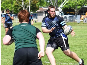 Nicholson (green) vs. Cobourg St. Mary's (blue) in the semi-final round of Wednesday's COSSA AAA senior boys rugby championships at MAS Park FIeld 3. (Cliff Malone for The Intelligencer)