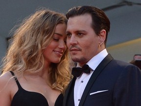 Johnny Depp and Amber Heard arrive for screening of the movie 'Black Mass' presented out of competition at the 72nd Venice International Film Festival on September 4, 2015 at Venice Lido. (TIZIANA FABI/AFP/Getty Images)