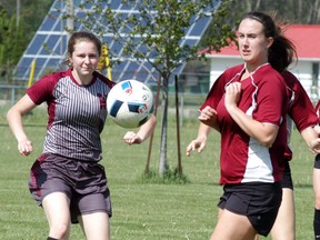 Wallaceburg Tartan girls soccer player Sydney Nutt, left, fires the ball at the net, during the LKSSAA 'AA' girls soccer final held at Perry Park on Thursday. Wallaceburg beat North Lambton 9-0 to advance to the SWOSSAA 'AA' girls soccer final on May 25.