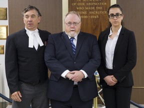 James Wilks is flanked by his law team of David Hodson and Diana Mansour during a break in Wilks' court martial at the HMCS Prevost in London, Ont. on Thursday May 25, 2017. (DEREK RUTTAN, The London Free Press)