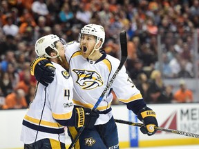 Colin Wilson (right) of the Nashville Predators reacts as he hugs teammate Ryan Ellis after scoring in the second period of Game Five of the Western Conference Final during the 2017 Stanley Cup Playoffs at Honda Center on May 20, 2017 in Anaheim, California. (Photo by Harry How/Getty Images
