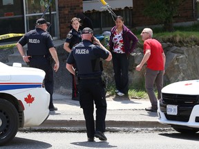 Police investigate a stabbing outside a Lloyd Street apartment building on Wednesday. (John Lappa/Sudbury Star)