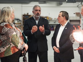 From left, Joscelyne Landry-Altmann, Deputy Mayor of Greater Sudbury; Emile Malvaso, chair, Centre of Excellence for Innovation and Enterprise at Cambrian College; Nickel Belt MP Marc Serre, and Sudbury MP Paul Lefebvre take part in a tour at Cambrian College on Thursday, after the MPs announced funding for a mining initiative at the college. Photo supplied