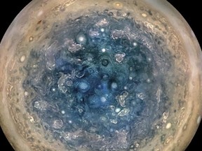 This image made available by NASA on Thursday and made from data captured by the Juno spacecraft shows Jupiter's south pole. The oval features are cyclones, up to 1,000 km in diameter. The cyclones are separate from Jupiter's trademark Great Red Spot, a raging hurricane-like storm south of the equator. The composite, enhanced colour image was made from data on three separate orbits. (NASA/JPL-Caltech/SwRI/MSSS/Betsy Asher Hall/Gervasio Robles via AP)