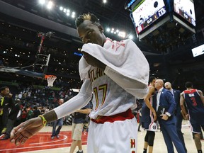 Atlanta Hawks' Dennis Schroder walks off the court after his team fell to the Washington Wizards in Game 6 of a first-round NBA playoff series on April 28, 2017. (Curtis Compton/Atlanta Journal-Constitution via AP)