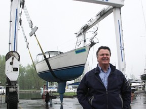 Dave Brown with Bridgeview Marina stands by a mobile lift he's letting people use free of charge to get their vessels in the water this season. Brown has also offered up his marina's boat ramp for use, without charge, while a city ramp, to replace one torn down at Centennial Park earlier this year, remains a work in progress. (Tyler Kula/Sarnia Observer/Postmedia Network)
