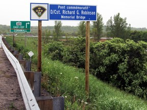 The sign dedicating the Joyceville Road overpass of Highway 401 in memory of  Det. Const. Richard Robinson  in Kingston. (Steph Crosier/The Whig-Standard)