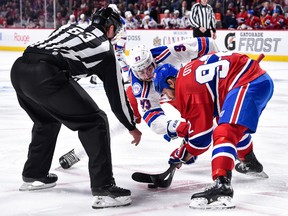 Mika Zibanejad of the New York Rangers and Steve Ott of the Montreal Canadiens faceoff in Game 1 during the NHL playoffs at the Bell Centre on April 12, 2017. (Minas Panagiotakis/Getty Images)