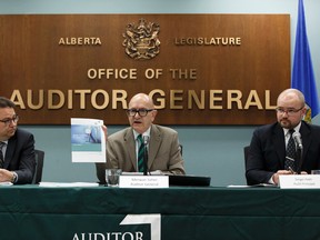 Auditor General Merwan Saher (centre) speaks about his Better Healthcare For Albertans report while Assistant Auditor General Doug Wylie (left) and Audit Principal Sergei Pekh listen during a press conference in Edmonton, Alta. on Thursday, May 25, 2017.