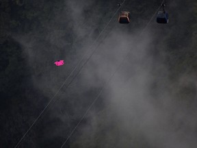 Wingsuit flyer is pictured in this file photo jumping off a mountain during the 5th World Wingsuit Championship at Tianmen Mountain on October 13, 2016 near Zhangjiajie, Hunan province, China. (Photo by Wang He/Getty Images)
