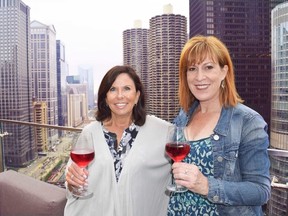 Reporter Steve MacNaull's wife, Kerry, left, was pen pals with Choose Chicago Greeter Joanne Guthrie-Gard over four decades ago. They are pictured on the 21st floor rooftop bar of LondonHouse Hotel. STEVE MACNAULL PHOTO