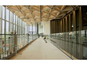 The old exterior walls (right) on the north side of the building will be a focal point in the new vaulted atrium surrounded by glass with a grand staircase and second-level glass walkway.