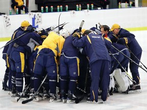 Predators players and coaches gather together at the end of a practice at their facility Thursday, May 25, 2017, in Nashville, Tenn. (AP Photo/Mark Humphrey)