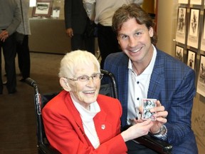Ryan Smyth poses with 92-year-old former Rockfort Peach Betty Carveth-Dunn on a tour through the Alberta Sports Hall of Fame in Red Deer on Friday, May 26, 2017.