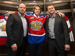 Edmonton Oil Kings' Head Coach Steve Hamilton, left, first-round draft pick Jake Neighbours, centre, and general manager Randy Hansch pose for a photo in the Oil Kings' dressing room in Rogers Place, in Edmonton Thursday May 25, 2017.