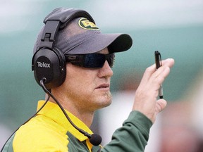 Edmonton Eskimos head coach Jason Maas calls a play against the Saskatchewan Roughriders during first half CFL pre-season action in Edmonton, Alta., on June 18, 2016.