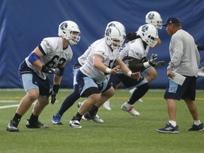 Argos offensive lineman Mason Woods (left) went 10th overall in this year’s draft. The Idaho product is adjusting to three downs. (Jack Boland/Toronto Sun)