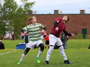 Aidan Clarini, left, of Lockerby Vikings, and Camaryn Baber, St. Mary's, go up for the ball during action at the junior boys AAA NOSSA soccer final at Lasalle Secondary School in Sudbury, Ont. on Friday May 26, 2017. St. Mary's won 1-0 in extra time. John Lappa/Sudbury Star/Postmedia Network