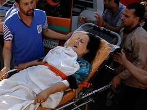 A woman wounded in an attack on Coptic Christians arrives at Nasser Institute Hospital in Cairo, Egypt, Friday, May 26, 2017.   (AP Photo/Ahmed Abd El-Gwad)