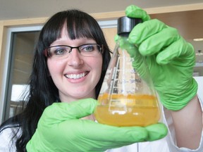 Nadia Mykytczuk a Environmental Microbiologist at the Living with Lakes Centre with a water sample in Sudbury, Ont. on Wednesday May 24, 2017. Gino Donato/Sudbury Star/Postmedia Network
