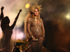 This Feb. 12, 2017, file photo shows Beyonce performing at the 59th annual Grammy Awards in Los Angeles. Beyonce and Jay Z celebrated the impending birth of their twins with a “push party” on May 20, 2017. (Photo by Matt Sayles/Invision/AP, File)