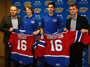 Edmonton Oil Kings Head Coach Steve Hamilton (left) and Edmonton Oil Kings General Manager Randy Hansch (right) welcome the team's two first round draft picks Liam Keeler and Matthew Robertson in Edmonton on May 16, 2016.