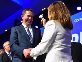 Andrew Scheer is congratulated by Rona Ambrose after being elected the new leader of the federal Conservative party at the federal Conservative leadership convention in Toronto on Saturday, May 27, 2017. (Frank Gunn/THE CANADIAN PRESS)
