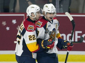 Erie Otters centre Anthony Cirelli (left) congratulates Dylan Strome on his goal against the Saint John Sea Dogs in Windsor, Ont. on Monday, May 22, 2017. (THE CANADIAN PRESS/Adrian Wyld)