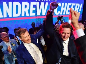Andrew Scheer, right, is congratulated by Maxime Bernier after being elected the new leader of the federal Conservative party at the federal Conservative leadership convention in Toronto on Saturday, May 27, 2017. (THE CANADIAN PRESS/Frank Gunn)