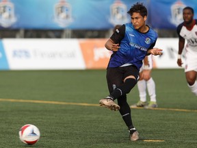 FC Edmonton's Dustin Corea (11) scores on a penalty kick during a NASL game versus the Indy Eleven at Clarke Stadium in Edmonton, Alta. on Saturday, May 27, 2017.